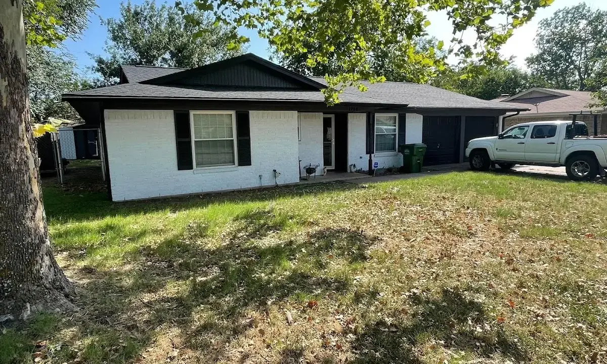 Professional roofing crew working on a residential roof in East Caln